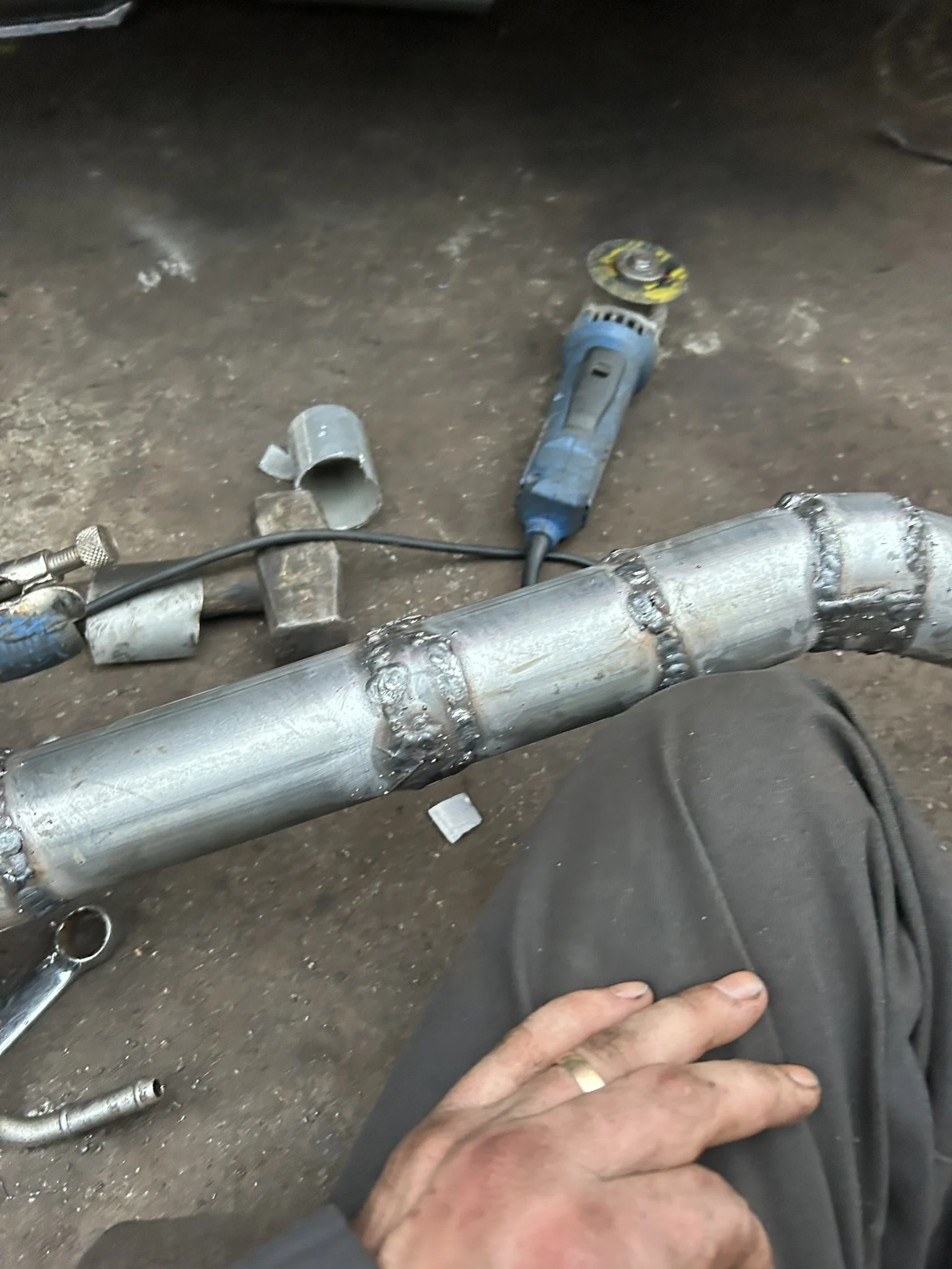 Exhaust components photographed during vehicle repair work